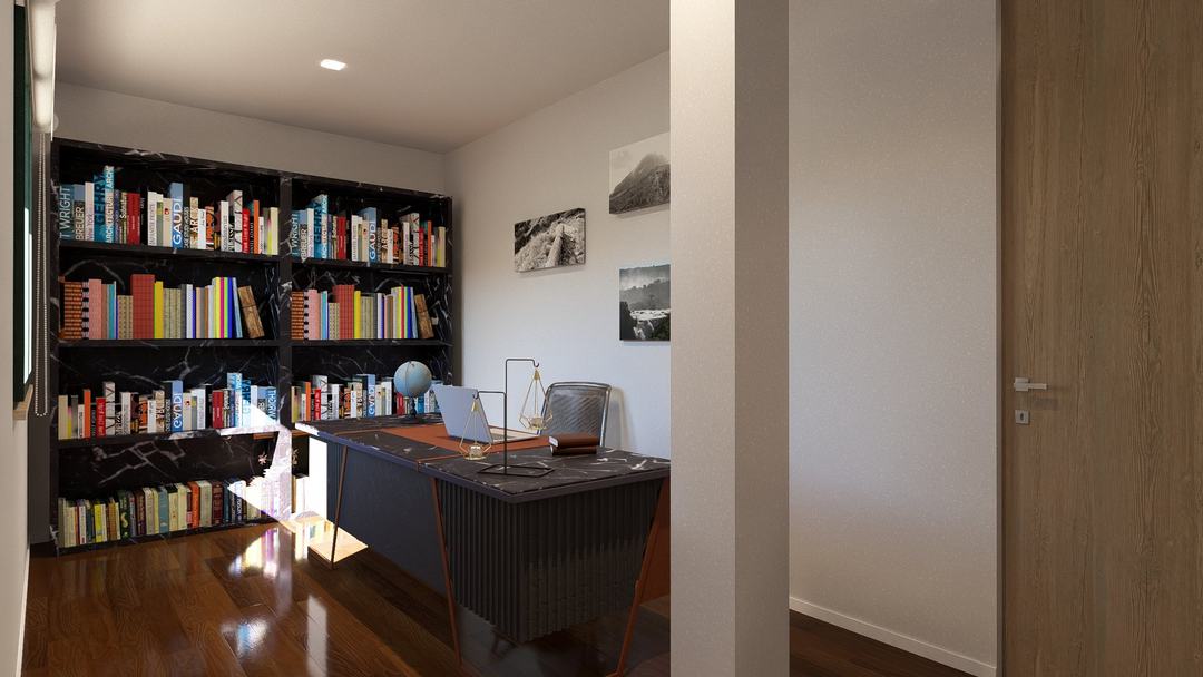 The study of Villa GB with a full bookcase wall and desk