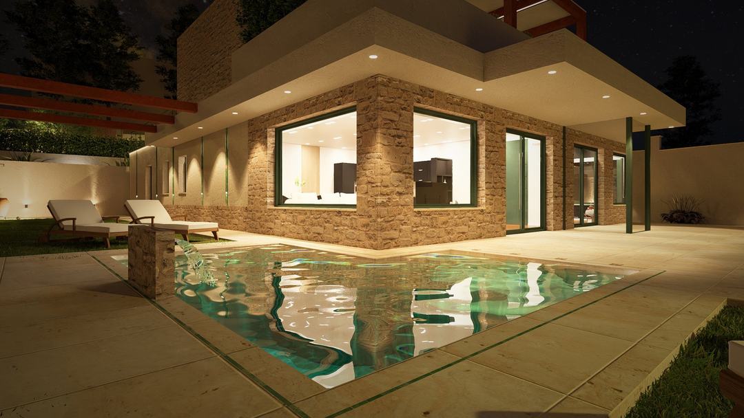 Villa HA pool glowing at night in front of the lit living room